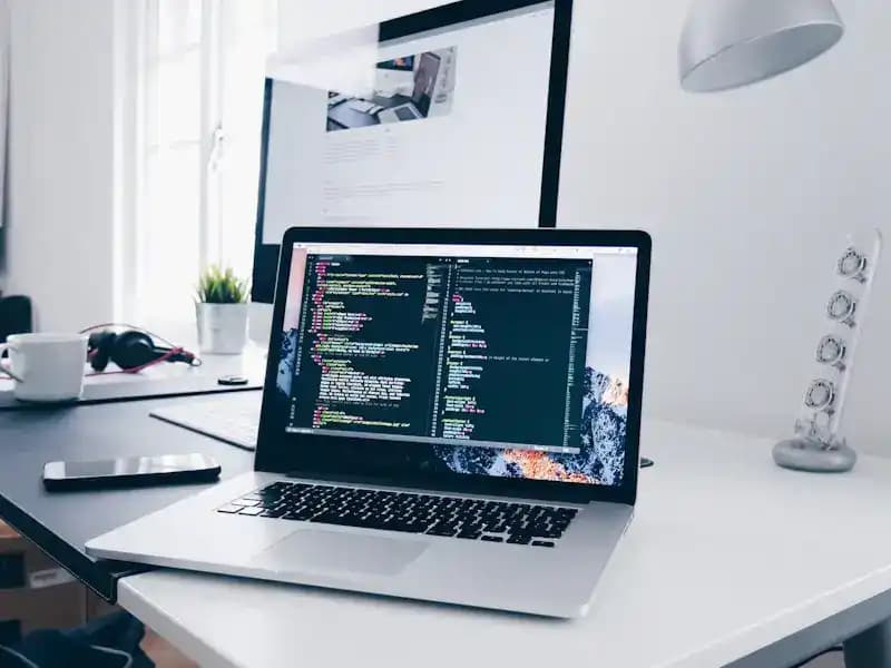 Developer workspace with code on screen